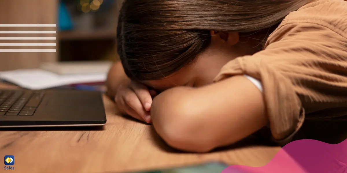 a girl who is putting her forehead on the desk is dealing with the consequences of fraping