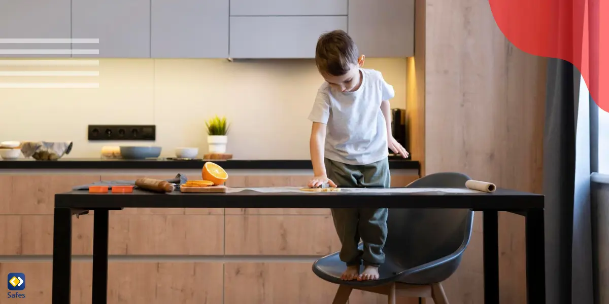 a young boy alone at home wiping the table