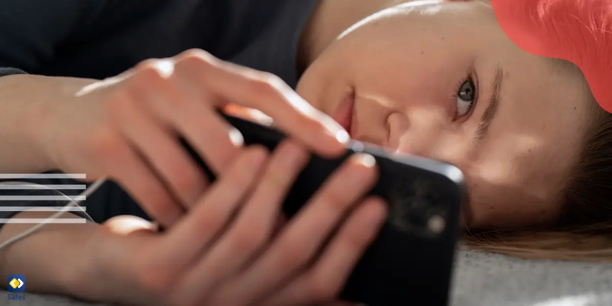 a teen girl lying on her bed watching porn with an anxious look on her face