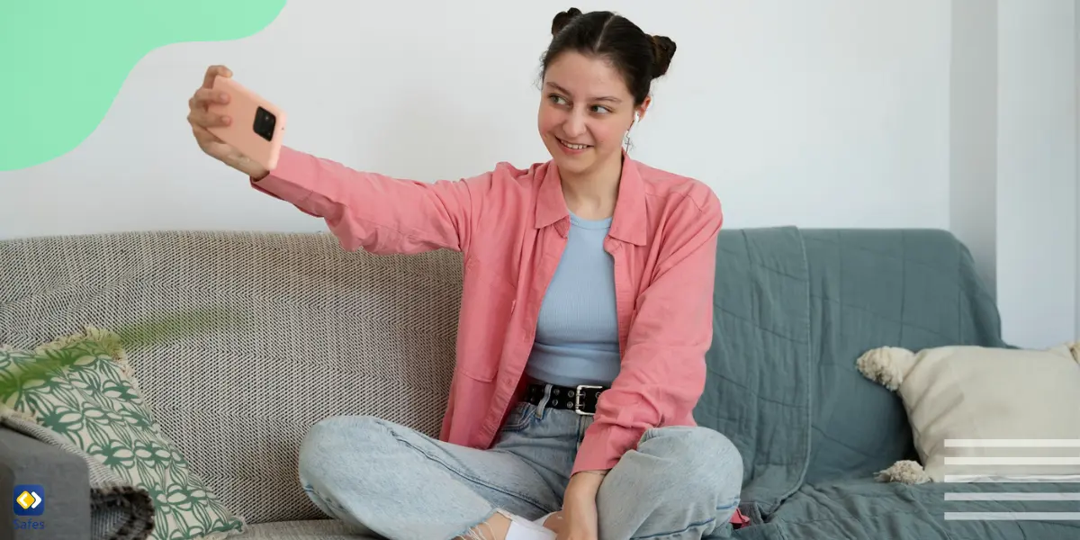 a smiley girl taking selfie for an online groomer