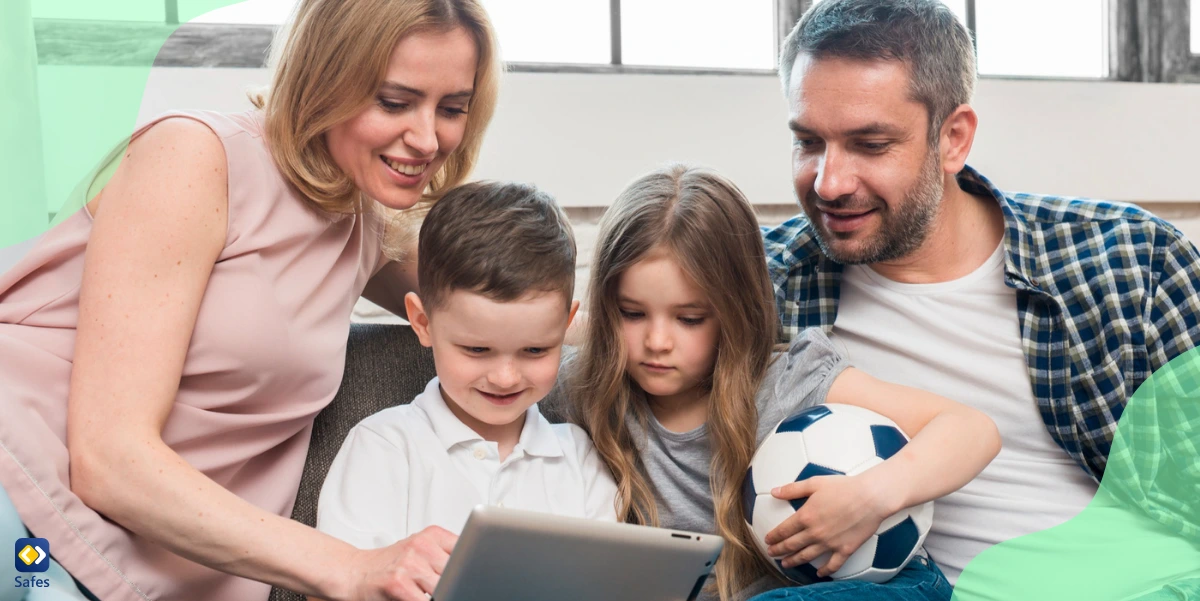 a family consisting of parents and two children are watching something on an iPad.