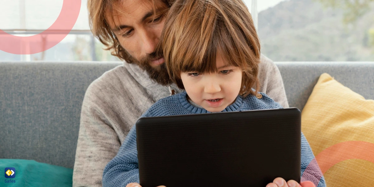 a father and his son are playing and working with a tablet