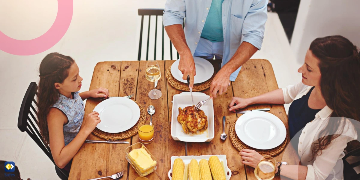 A family of four sitting at the dinner table, without any electronic devices nearby.