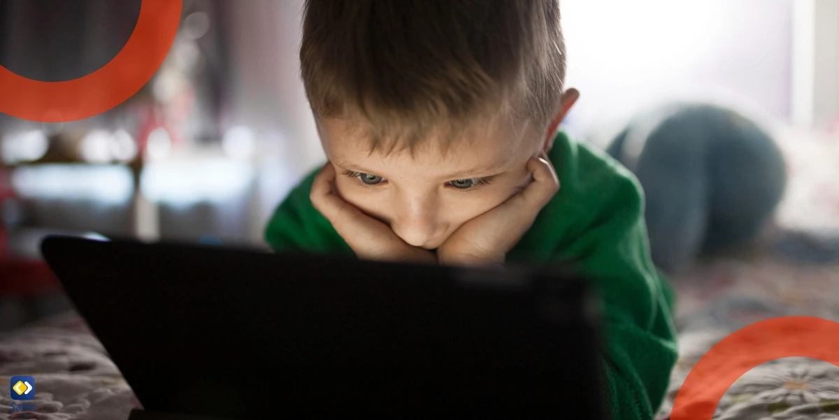 boy using dangerous apps on tablet