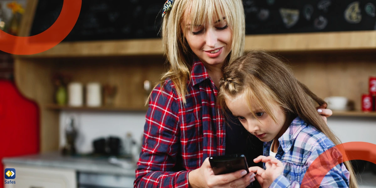 Mother teaching her daughter how to check if her phone has a virus in settings