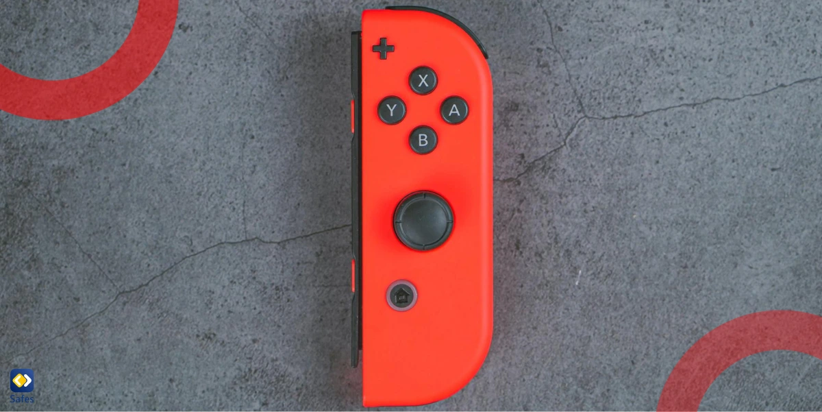 Der rote Joy-Con von Nintendo Switch auf einem konkreten Hintergrund