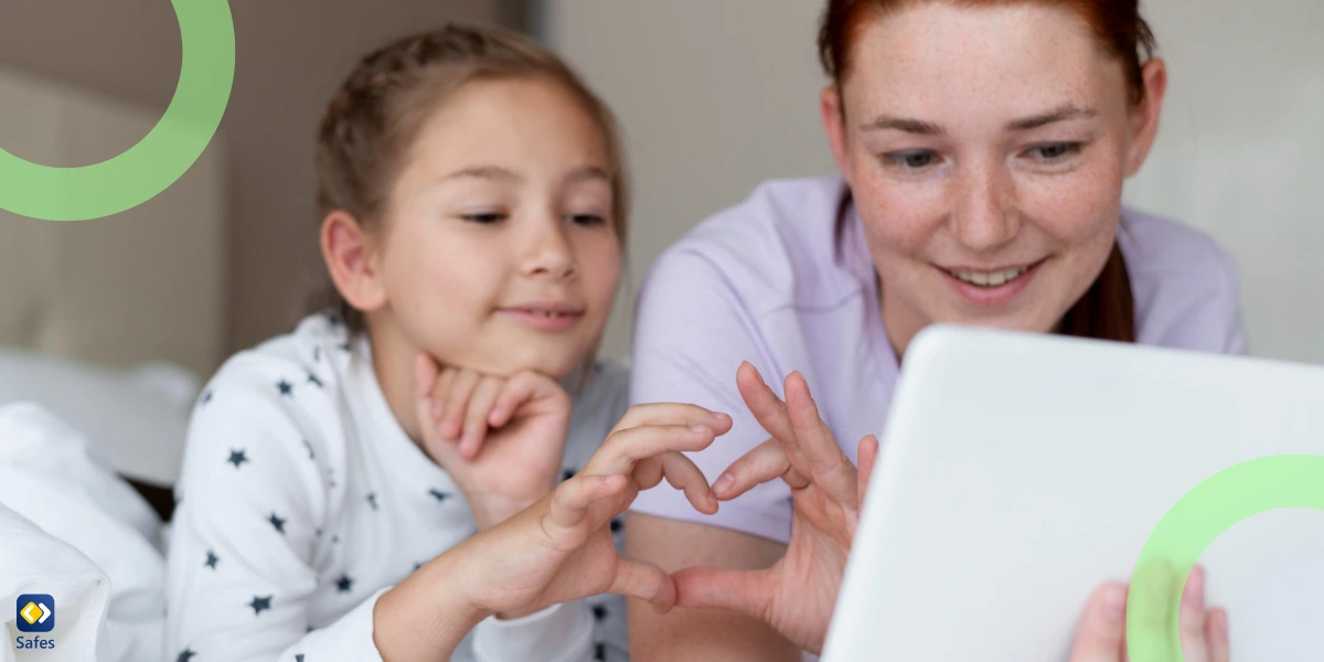 Mother educating her daughter with digital literacy using a tablet to help her reach the age of digital consent sooner