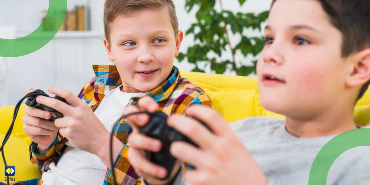 Two boys playing Xbox games with controllers in their hands