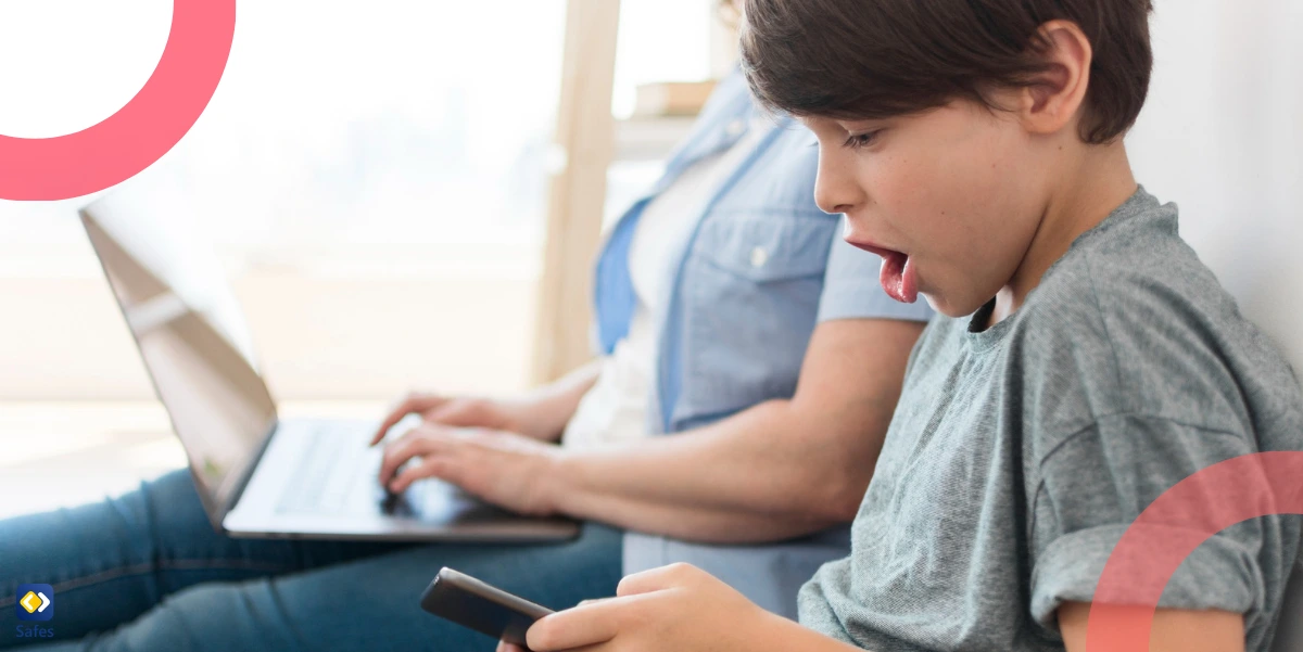 a boy playing on a smartphone next to his mom and shocked by what he sees in the game