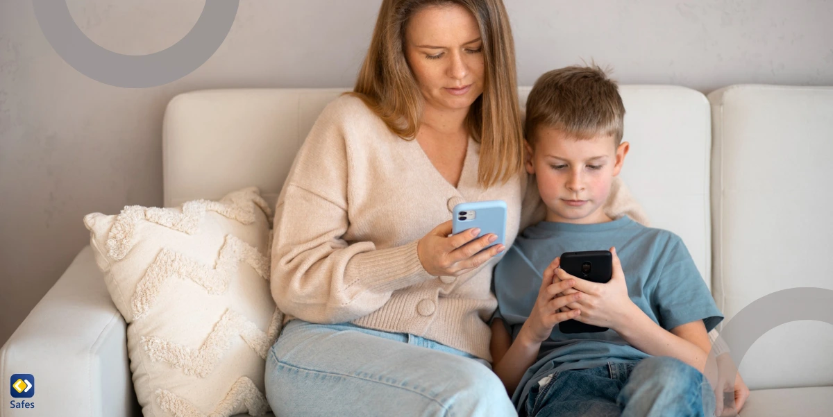 a mother is sitting next to his son checking his online activities on her phone