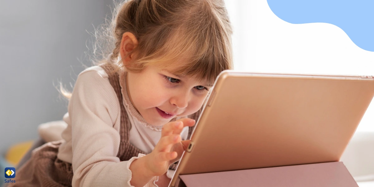 a young boy working with a tablet in his hands.