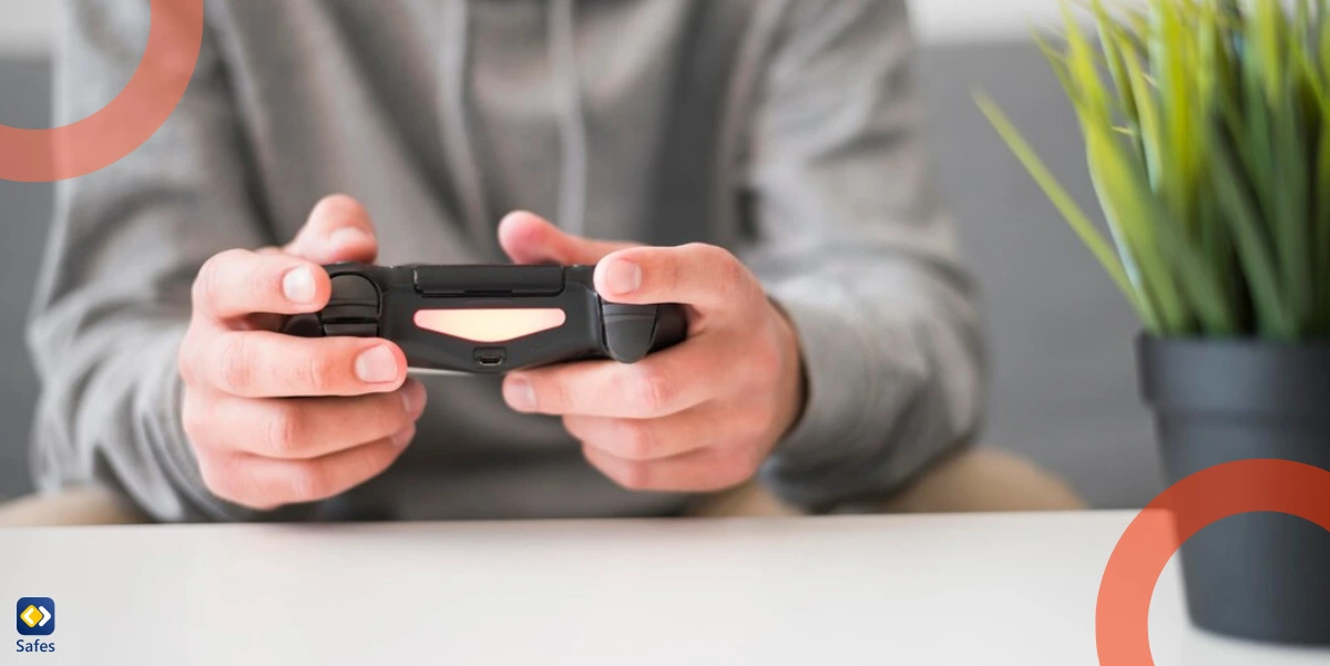 A teenager playing a video game with a controller in his hand.