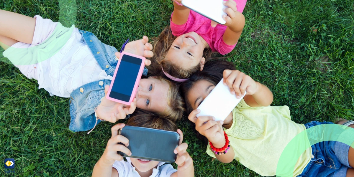 Happy children using the cheap phones for kids