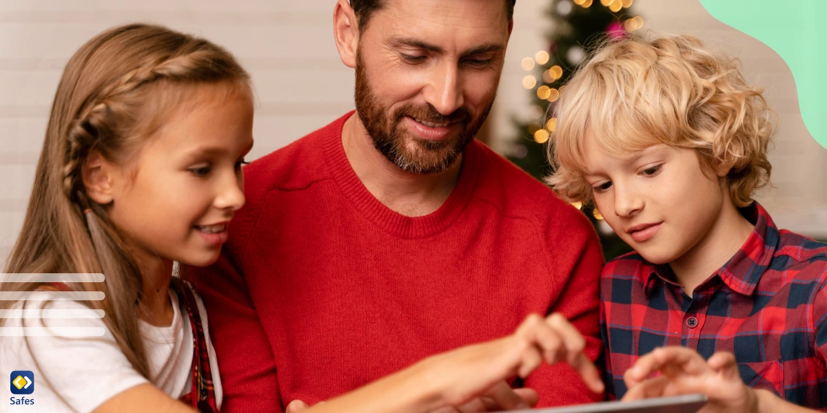 Father using tablet with his two children