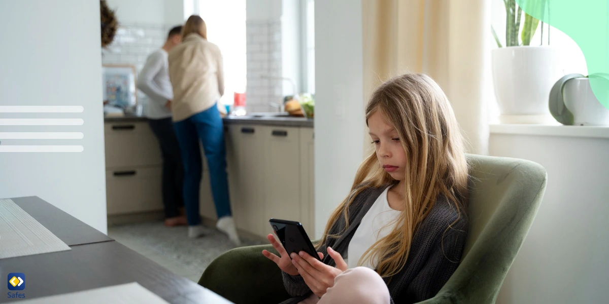 child using phone with parents in the background