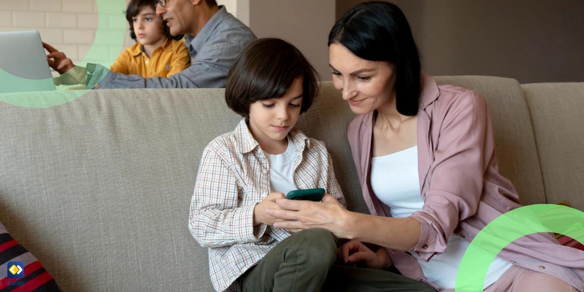 a mother and son looking together on a smartphone