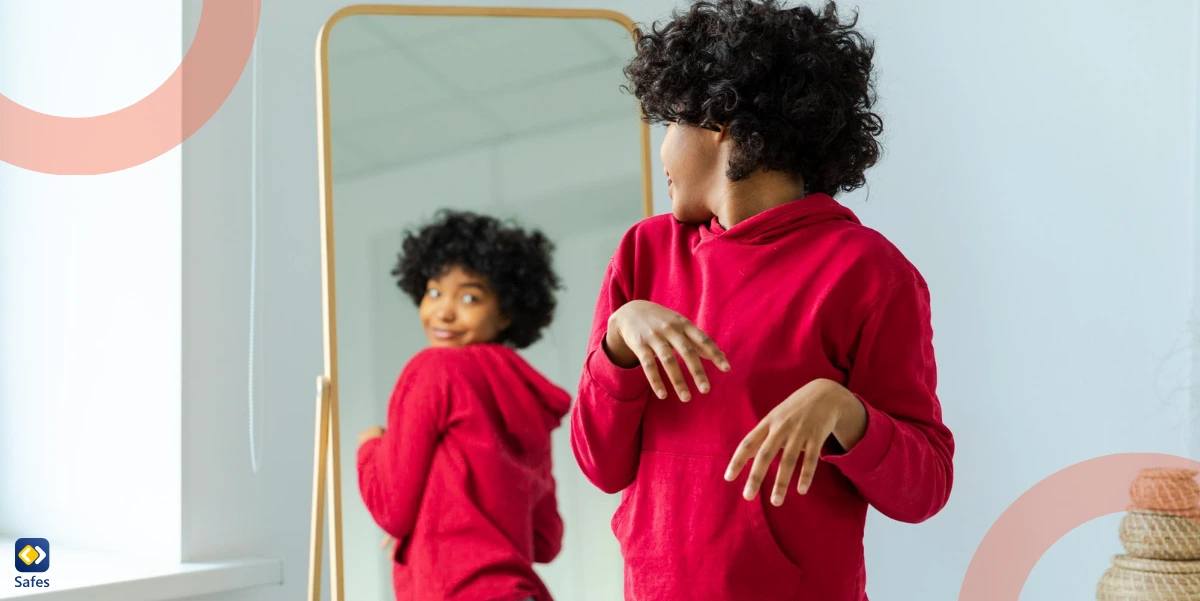 teen watching her body in a mirror