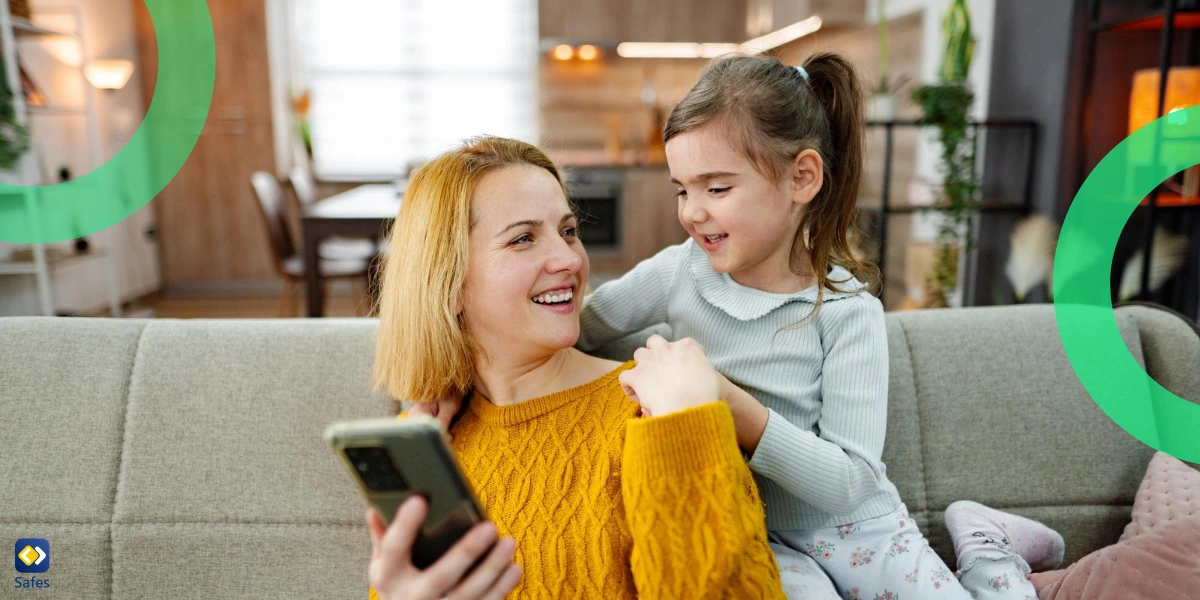 mother and daughter using phone