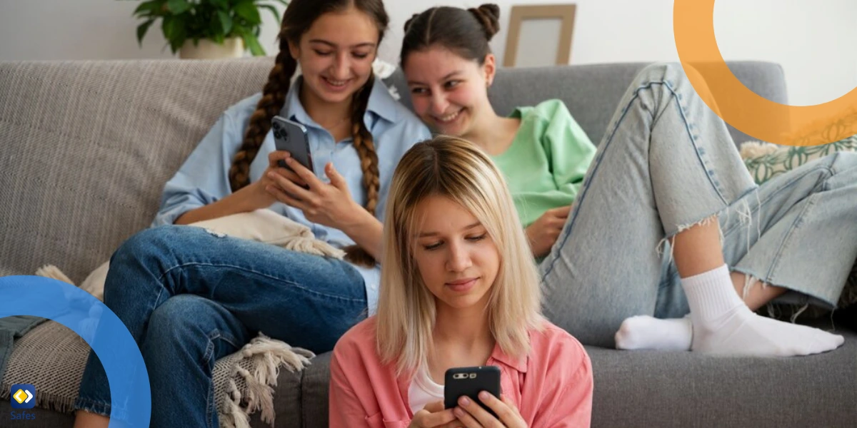 three teen girls with smartphones at home