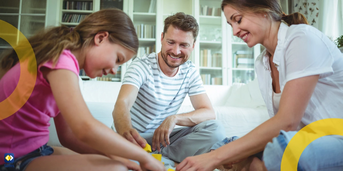 family of three playing with blocks