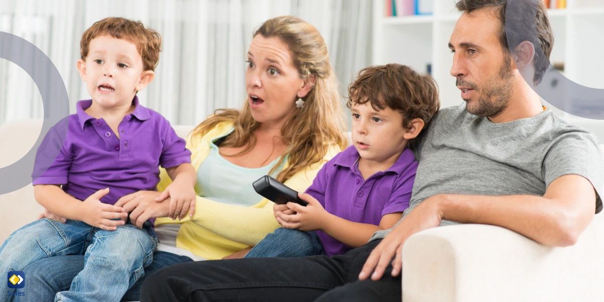 scared family watching tv