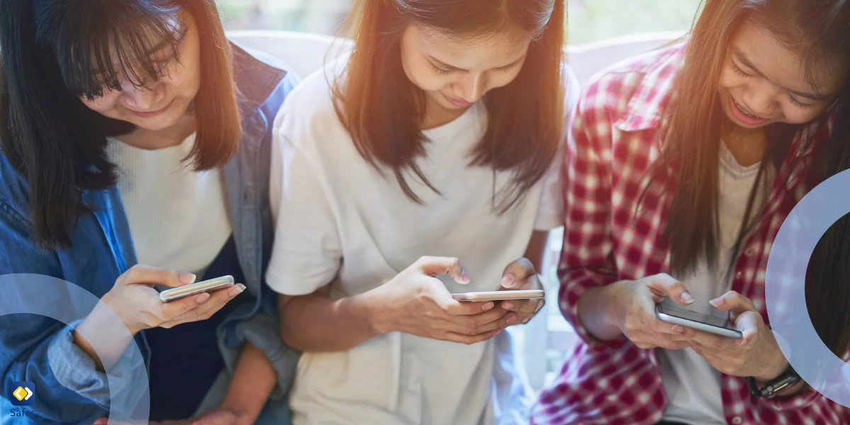 three teen girls using their smartphones