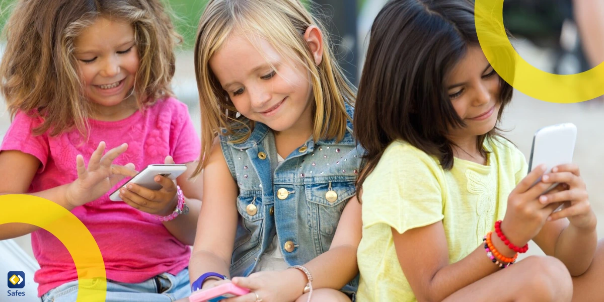 children are using their phones to chat online in the park.