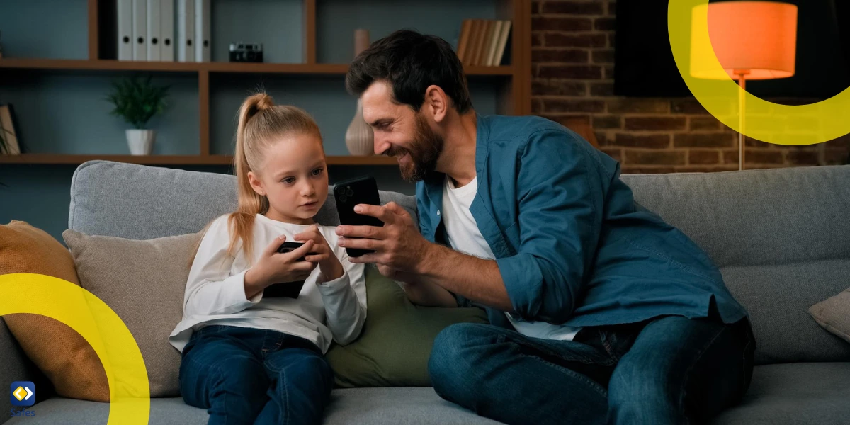 father and daughter with their phones