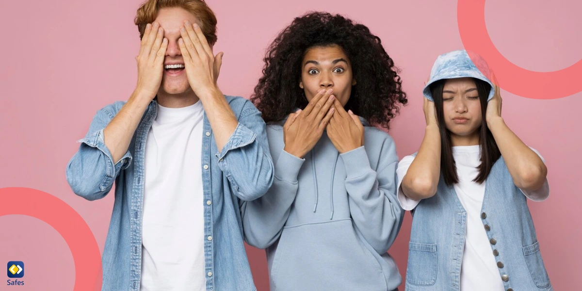 Three young people pose against a pink background, playfully covering their eyes, mouth, and ears in a "see no evil, hear no evil, speak no evil" style.